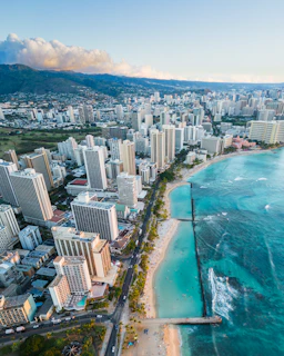 an aerial view of a city and the ocean