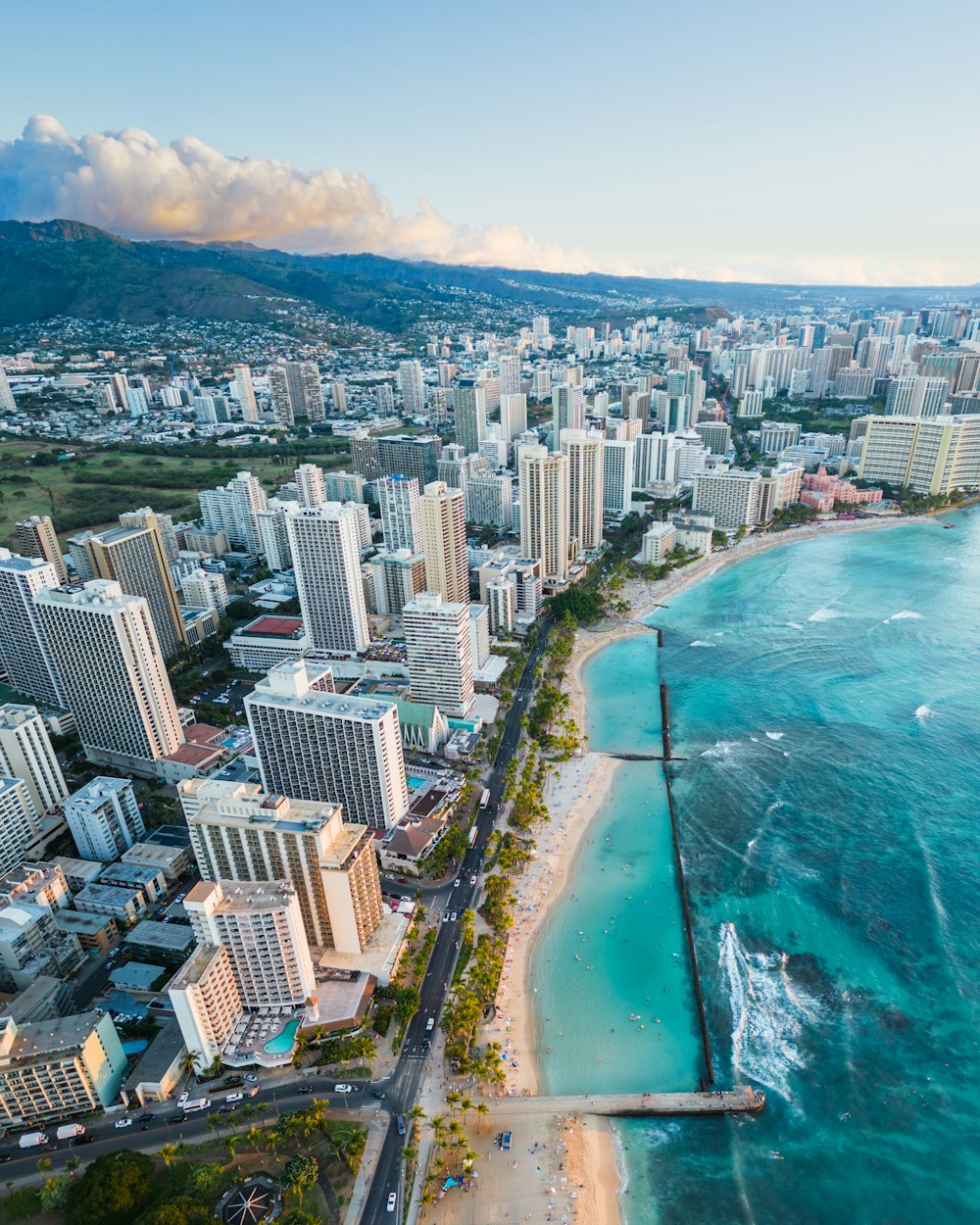 an aerial view of a city and the ocean