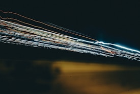 Visual representation of blazing fast 10 Gbit/s internet speed with dynamic streaks of light.