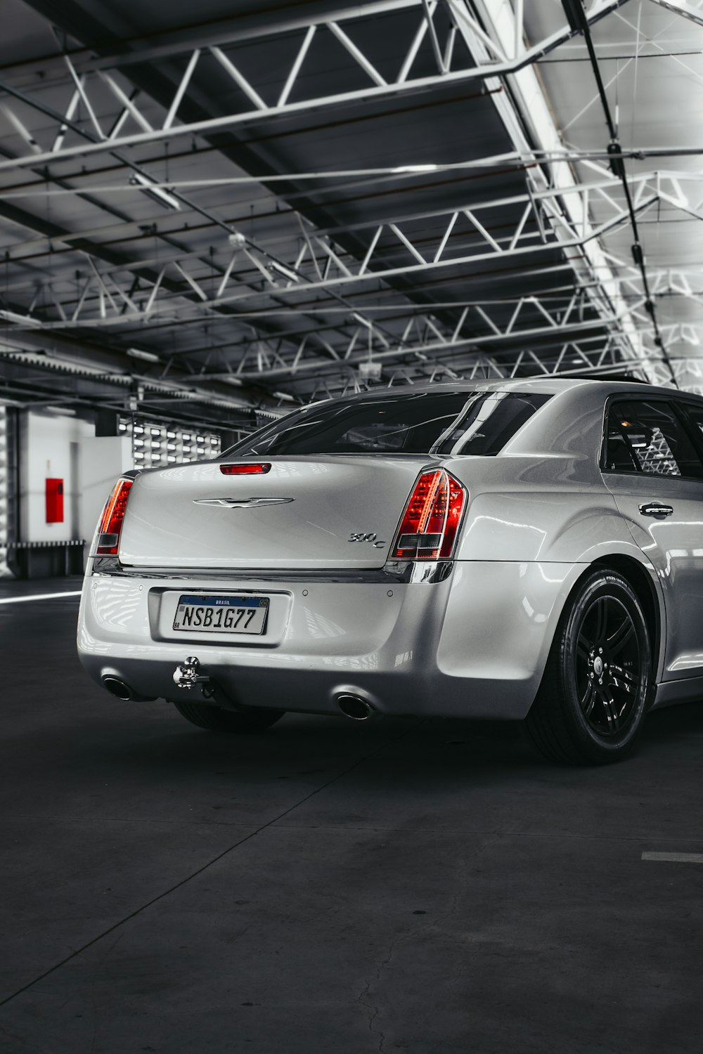 a silver car parked in a parking garage