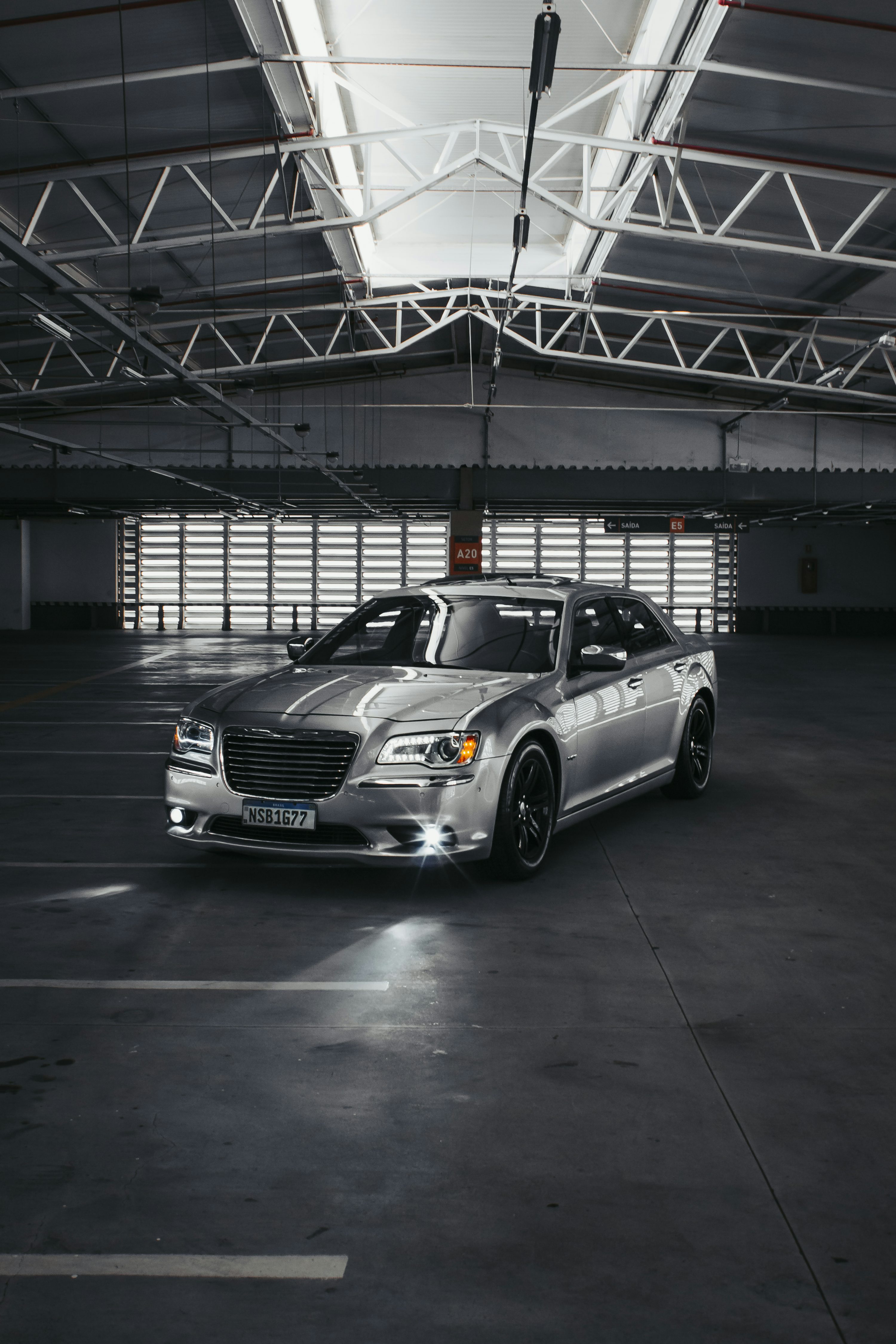 a silver car parked in a parking garage
