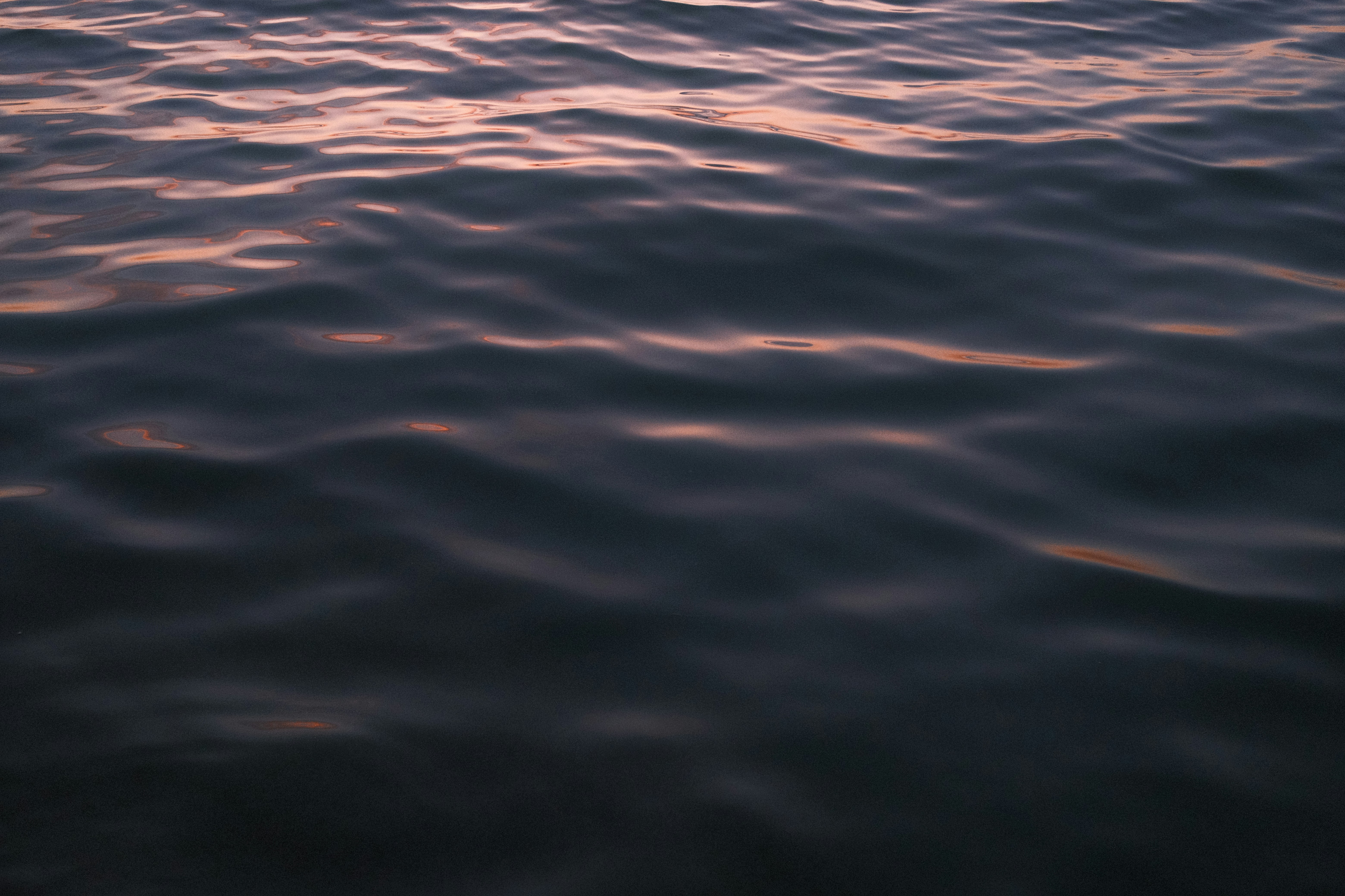a body of water with a boat in the distance