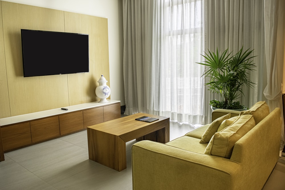 a living room filled with furniture and a flat screen tv