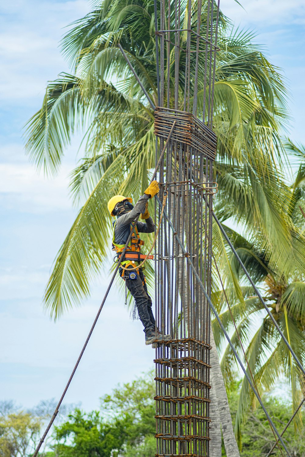 a man is climbing up a tall tower