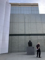 Casual photo of the second founder reviewing construction materials outdoors