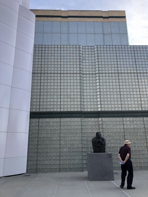 Casual photo of the second founder reviewing construction materials outdoors