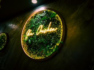 An inviting storefront sign of chuckin chicken llc glowing warmly at dusk.