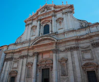 Historic church facade in Cavite, showcasing intricate colonial architecture.
