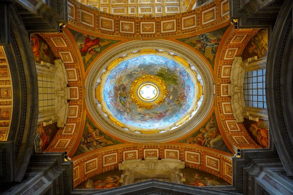the ceiling of a building with a painted dome