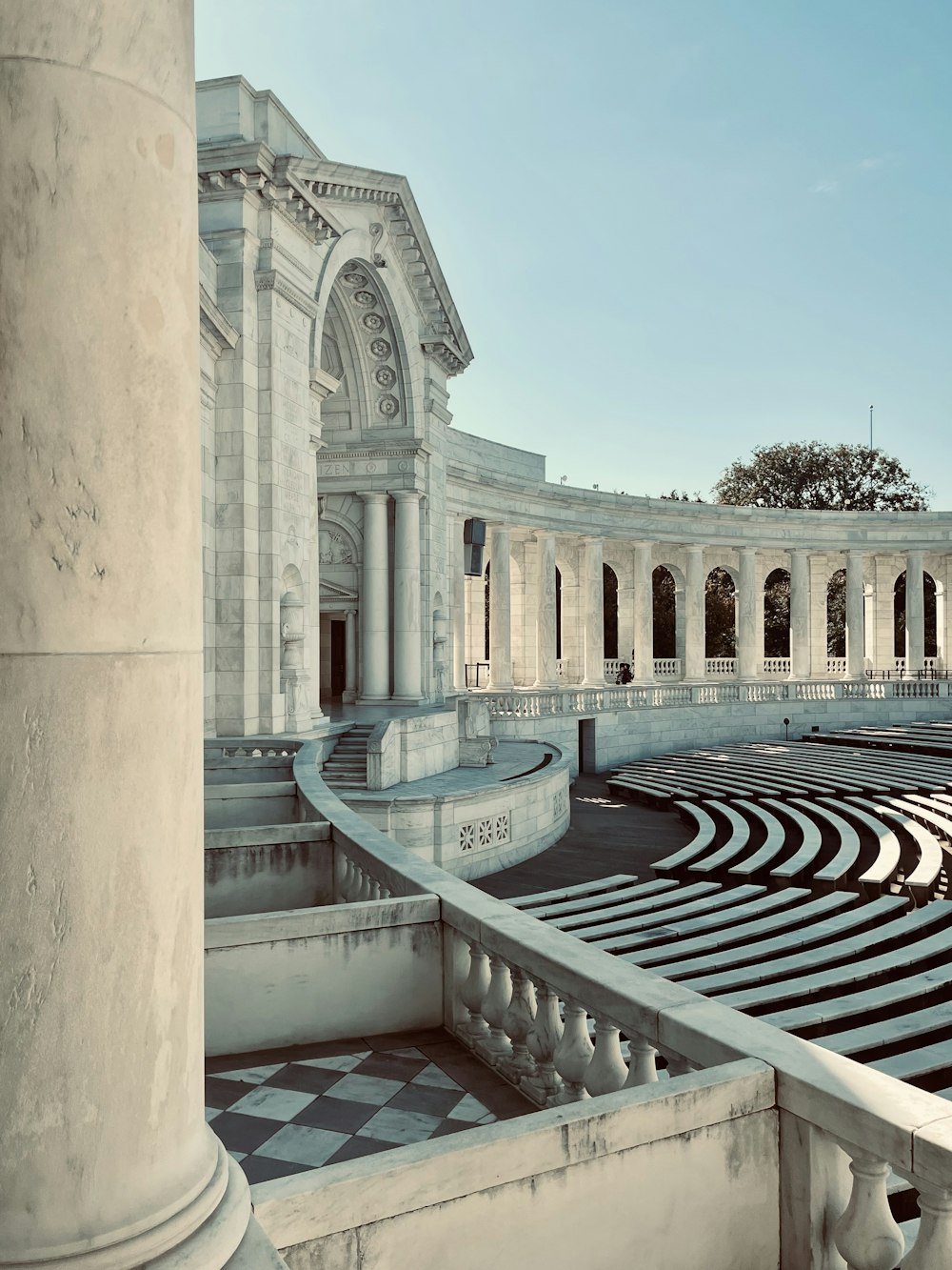 a large building with a fountain in front of it