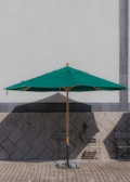 A stylish patio umbrella stand featured in an outdoor setting.