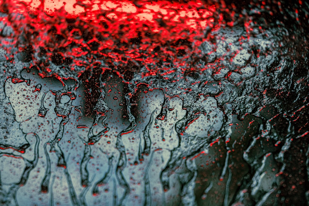 a close up of a rain covered window