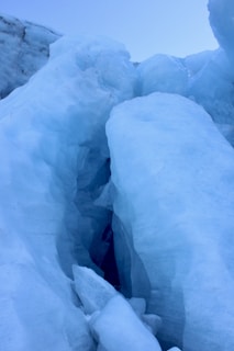Close-up of a glacier ice formation with vibrant blue shades.