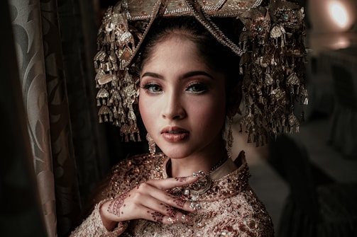 A vibrant portrait showcasing a person in traditional Indian attire with intricate patterns.