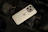 Close-up of a sleek smartphone with a stylish aslihay accessory attached.