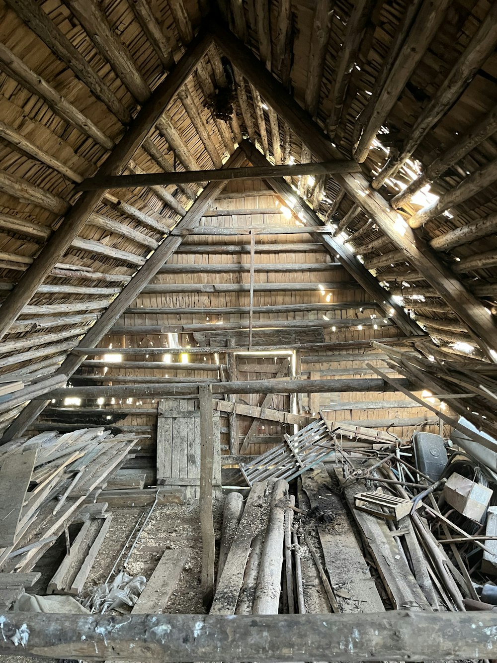 a wooden structure with a roof made of wood planks