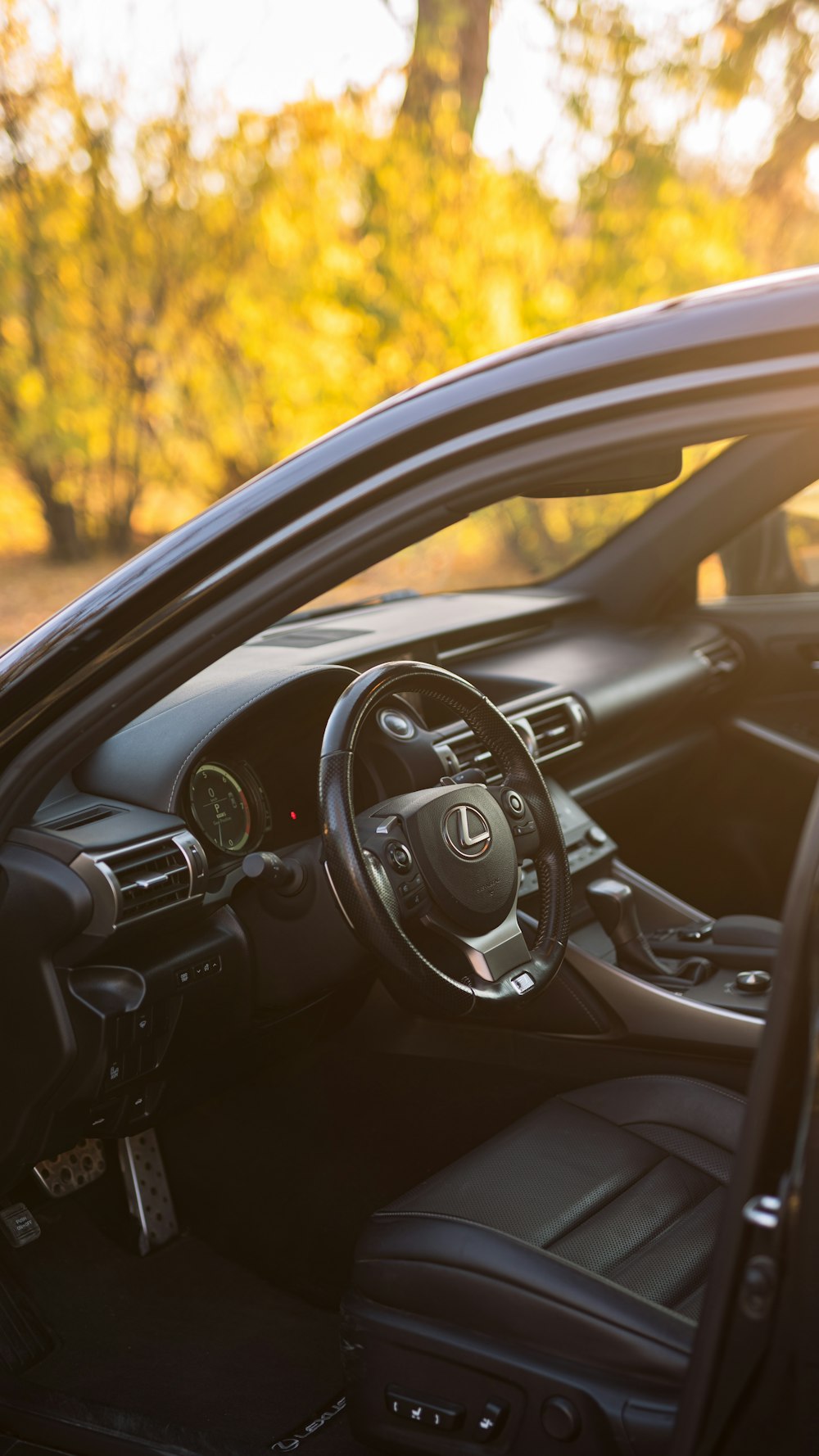 the interior of a car with the sun shining through the windshield