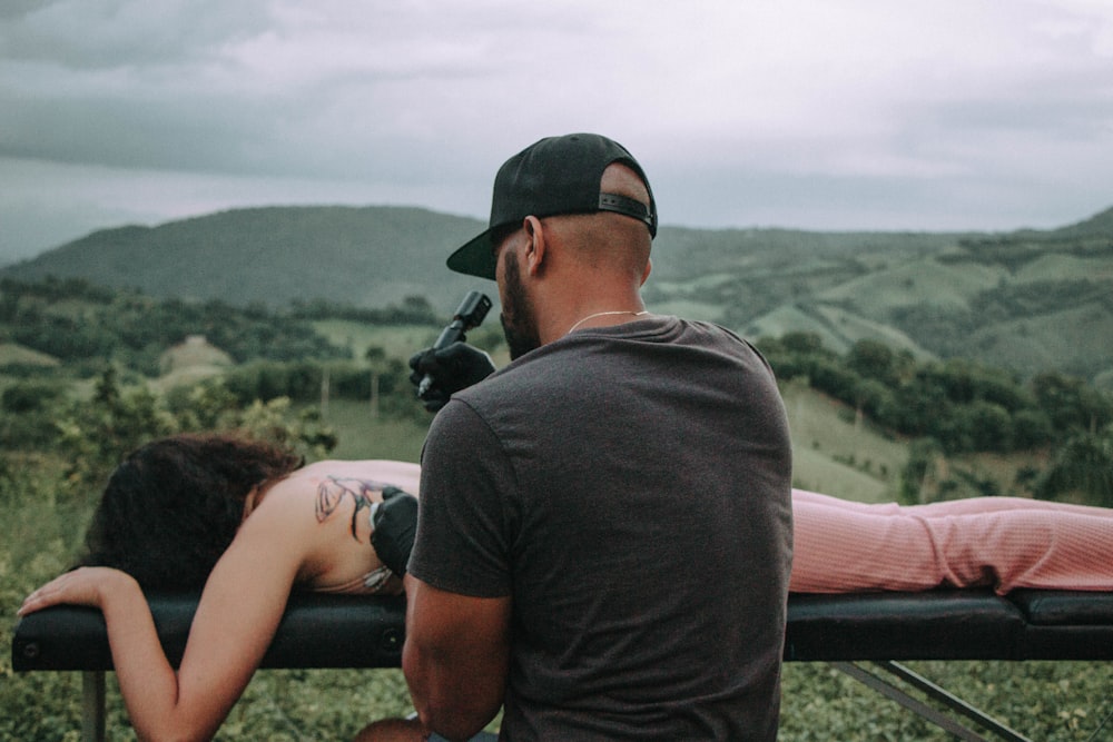 a man and a woman are sitting on a bench