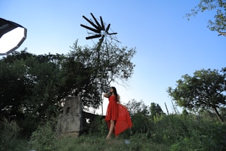 A stylish outdoor photo session setup with vintage props and lush greenery.