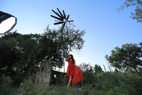 A stylish outdoor photo session setup with vintage props and lush greenery.