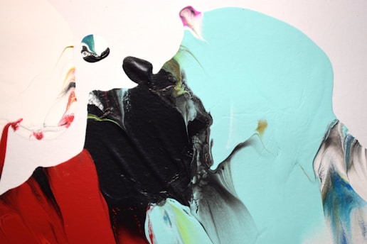 A close-up of Sarah Fenwick's vibrant red and black abstract painting, with brushstrokes that echo the rhythm of jazz.