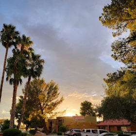A peaceful sunset over a Filipino neighborhood, symbolizing care and comfort.