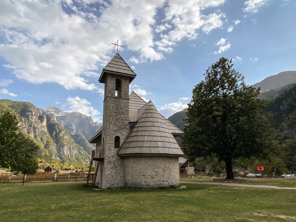 a small church with a cross on top of it