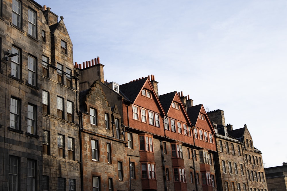 a row of old brick buildings on a sunny day