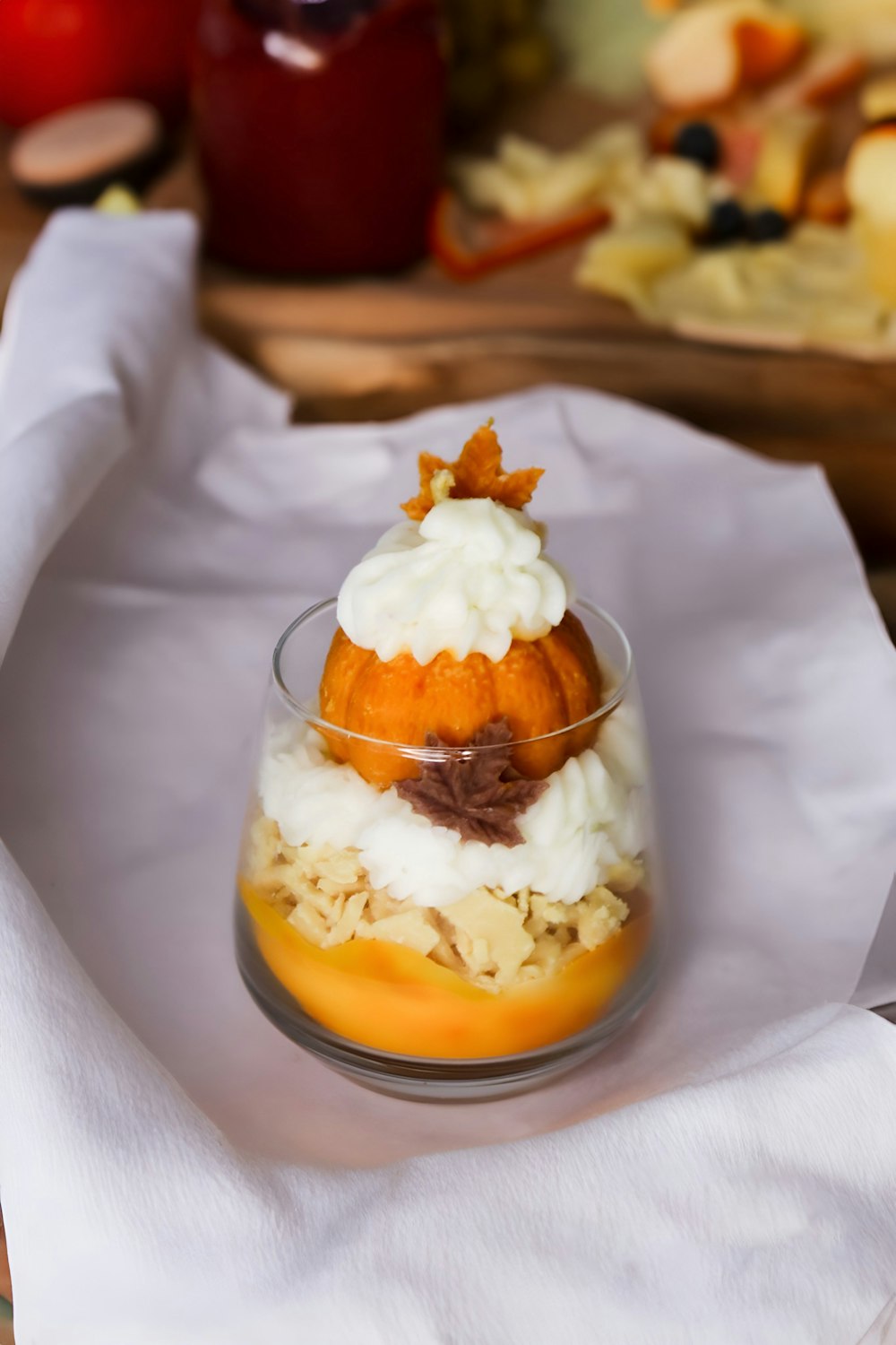 a dessert in a glass dish on a napkin