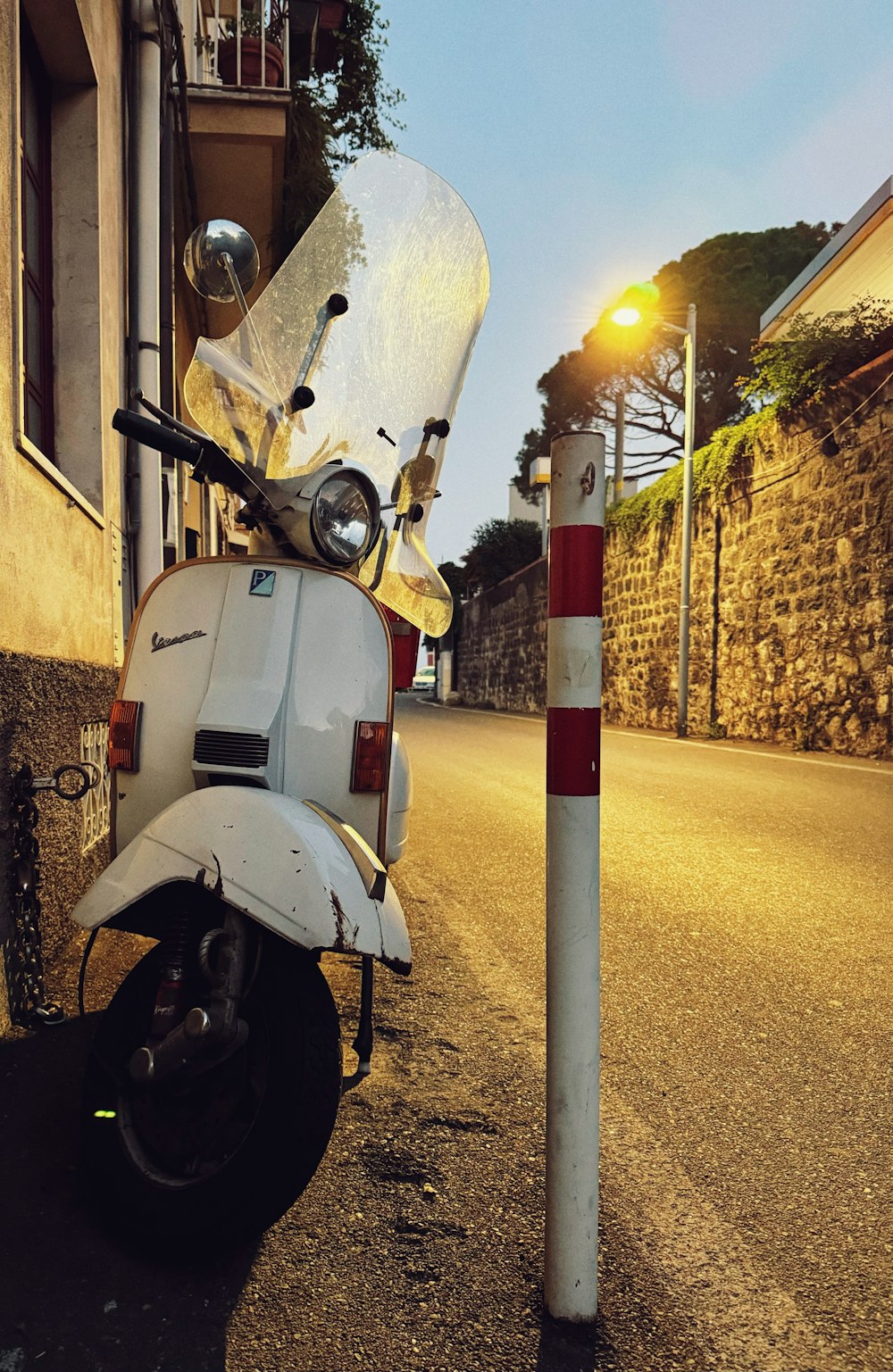 a scooter parked on the side of the road