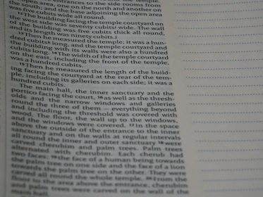 Close-up of a detailed technical report with photos and metric calculations.