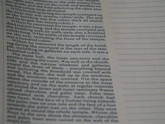 A close-up image of a page from a book or printed text. The text is written in English and describes architectural measurements and structures in detail. The page also has a lined margin on the right side.