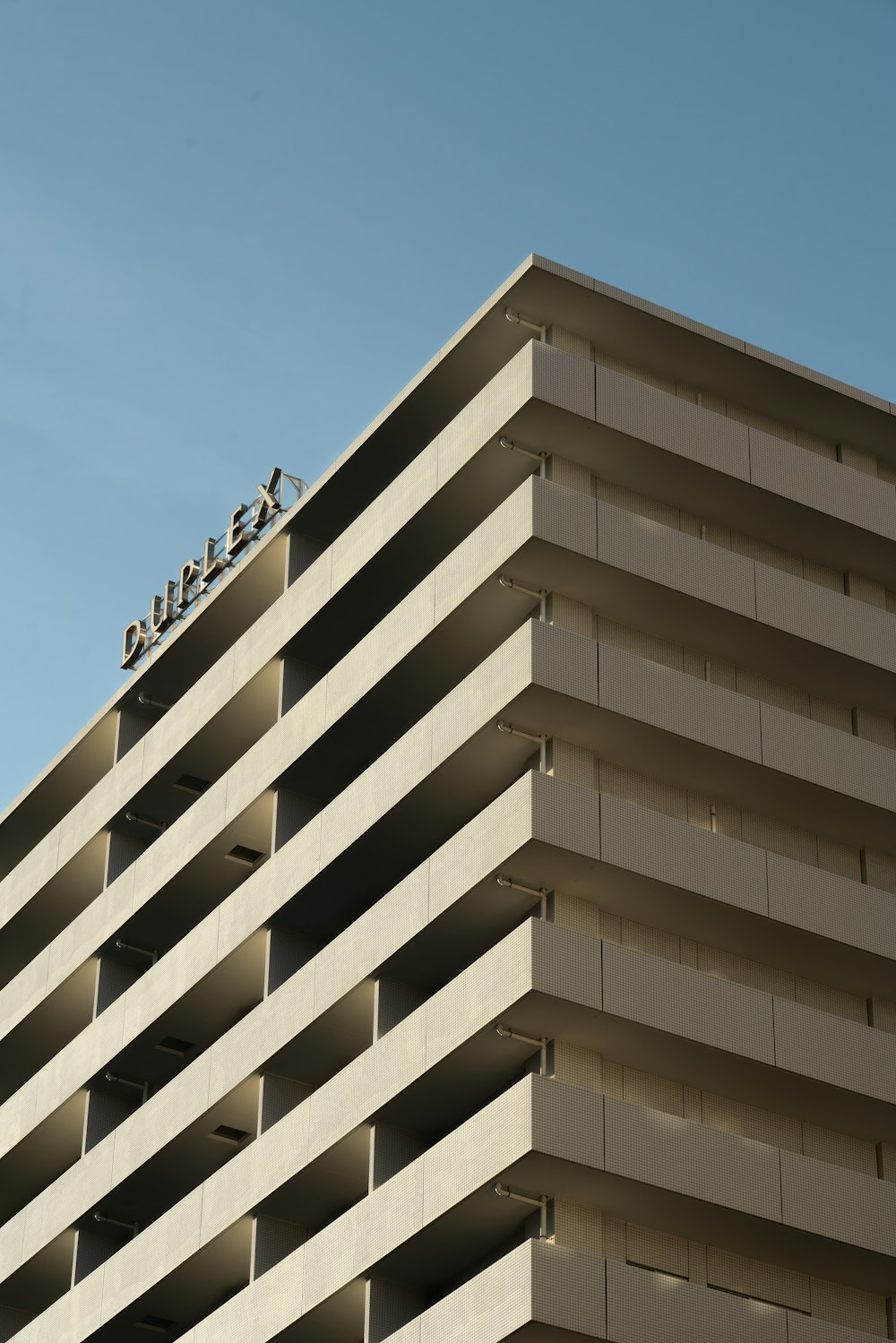 a tall building with a sign on top of it