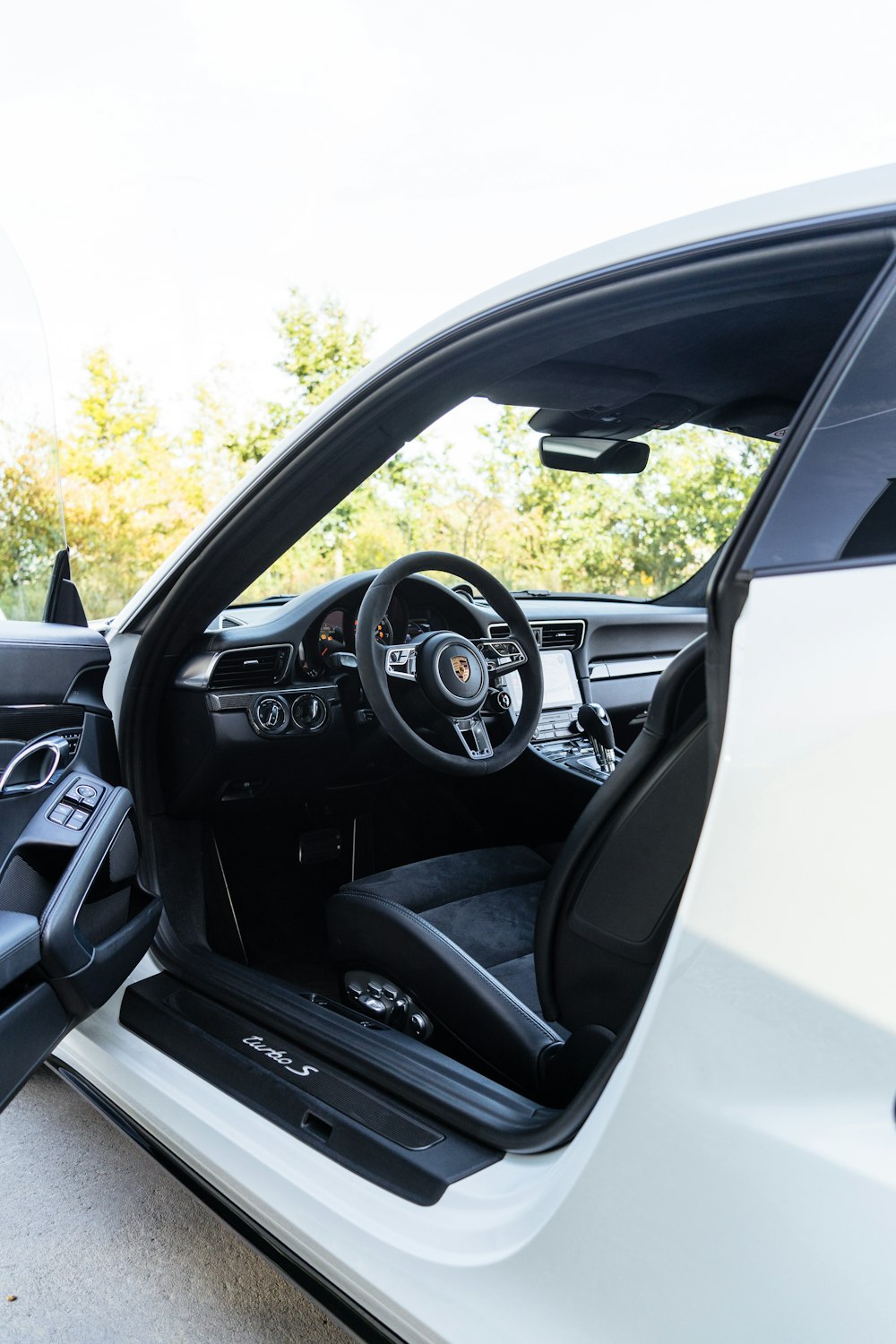 the interior of a car with the door open