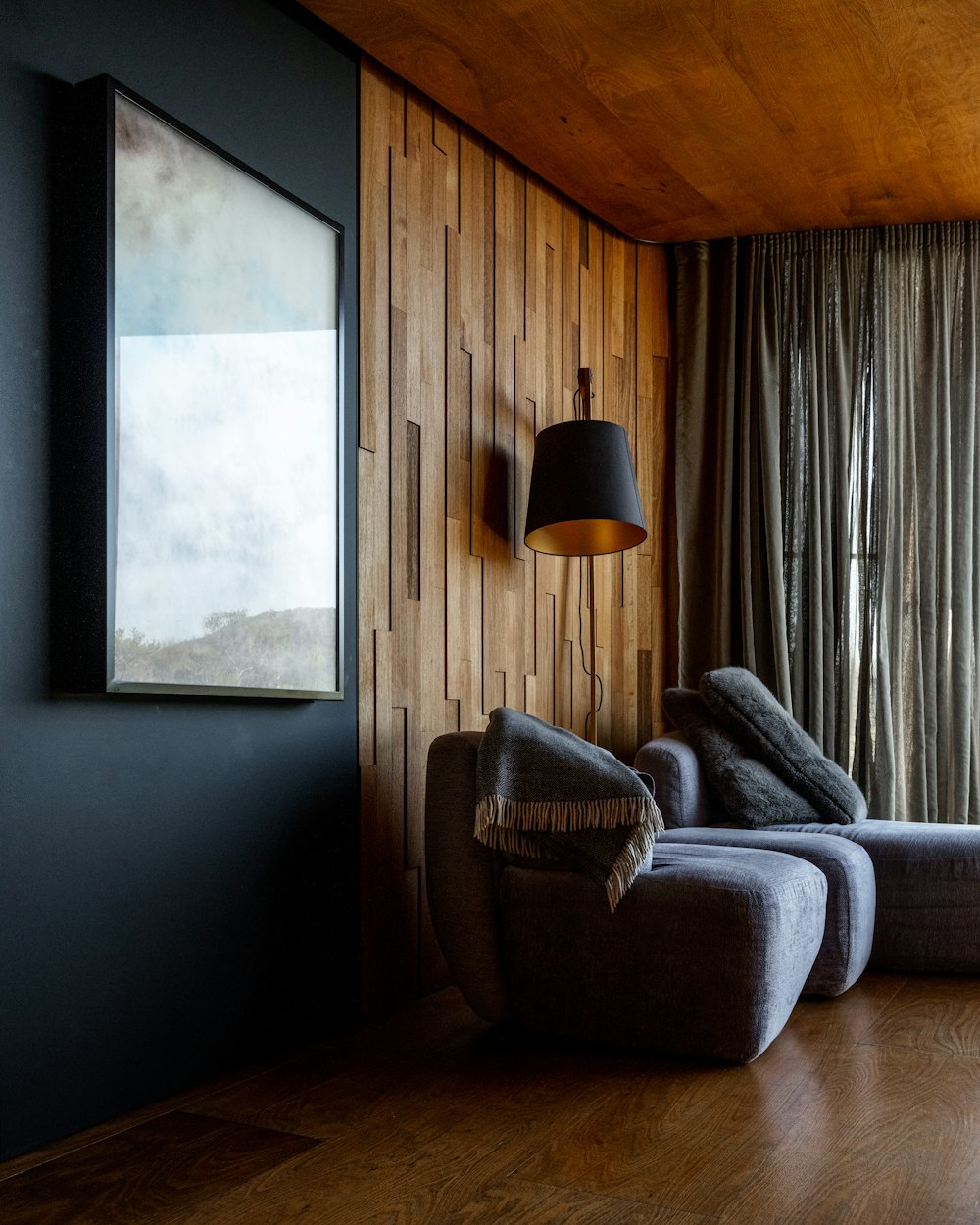 a living room filled with furniture and a large window