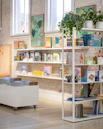 a room filled with lots of books on shelves