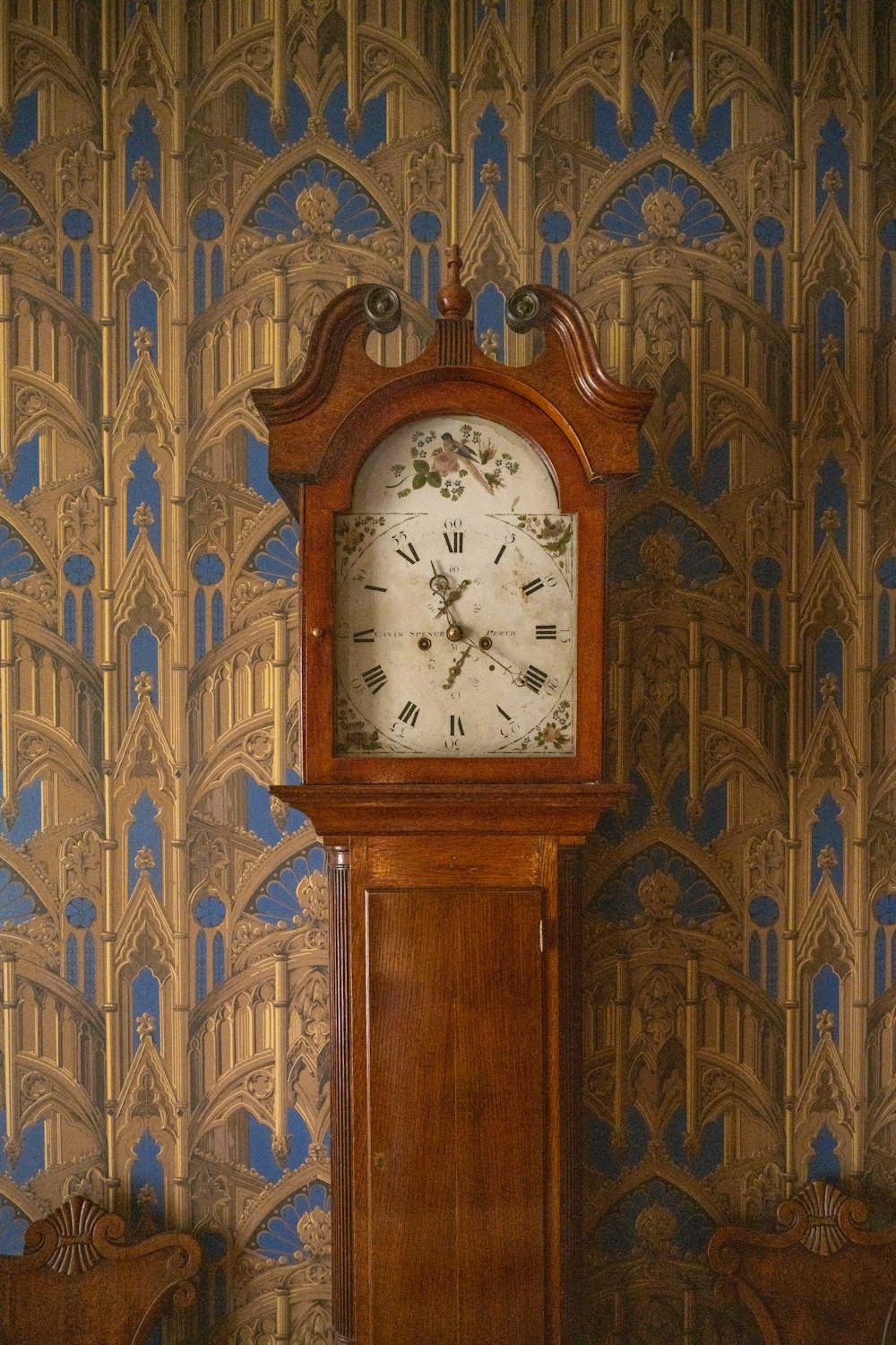 a grandfather clock sitting in a corner of a room