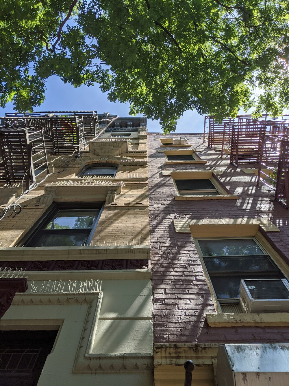 a tall brick building with lots of windows