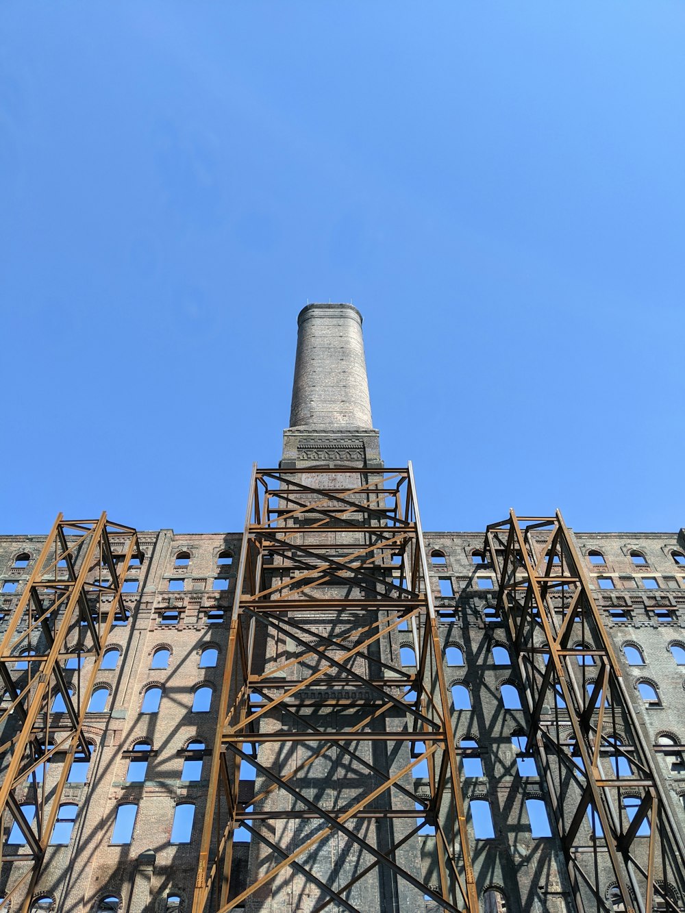 a very tall building with a clock on it's side