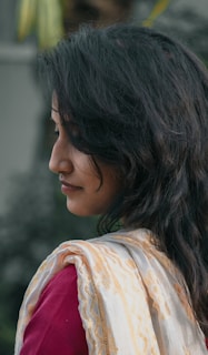 a close up of a person wearing a scarf