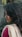 a close up of a person wearing a scarf