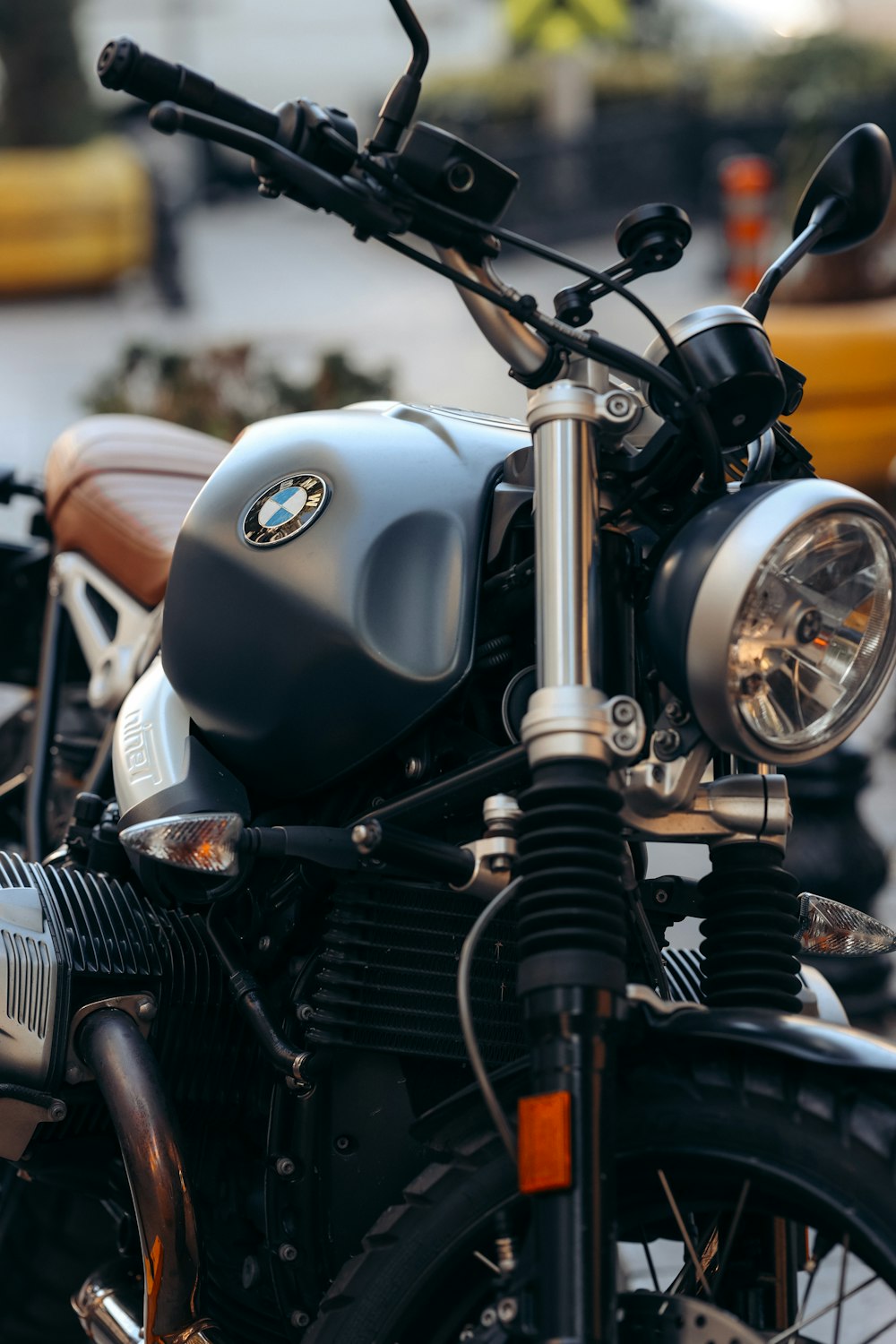 a close up of a motorcycle parked in a parking lot