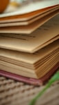 a stack of books sitting on top of a table