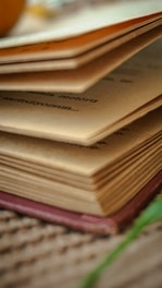 a stack of books sitting on top of a table