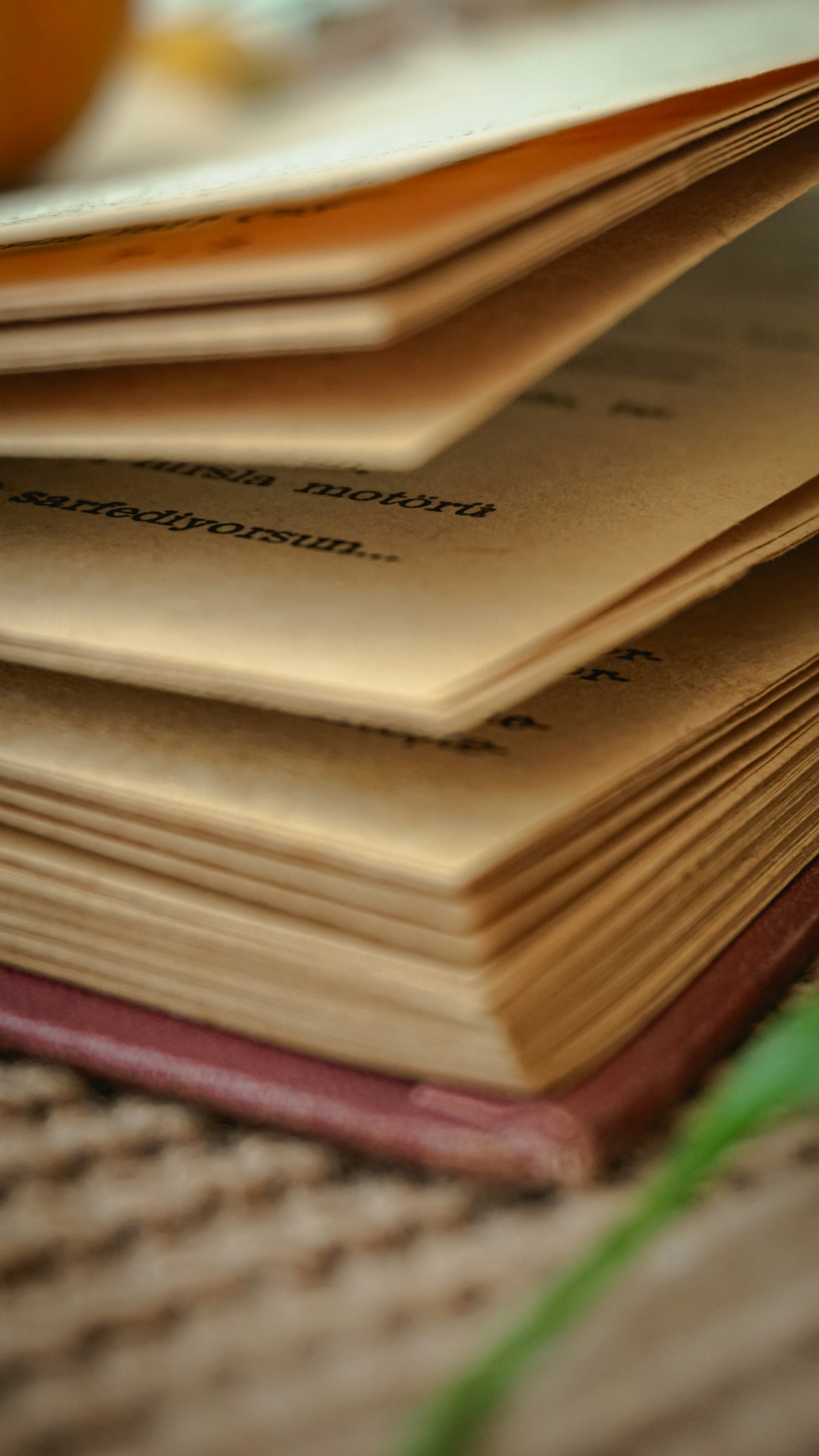 a stack of books sitting on top of a table