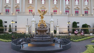 a large building with a statue in front of it