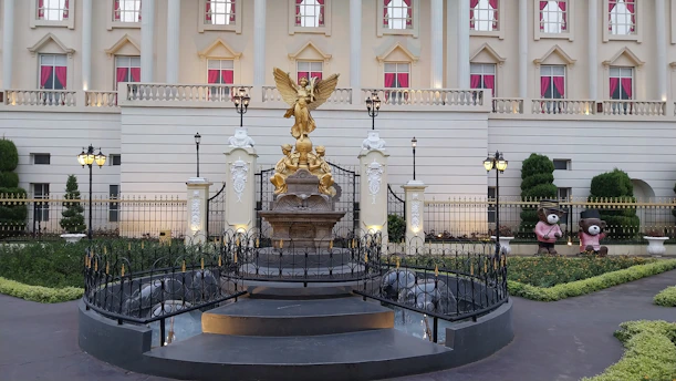 a large building with a statue in front of it