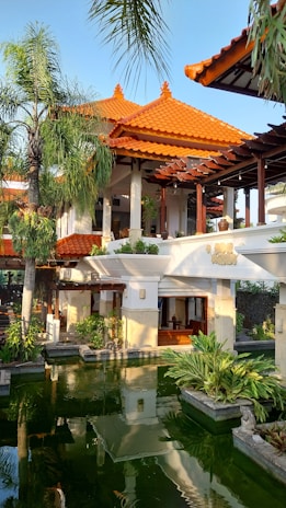 a building with a pond in front of it