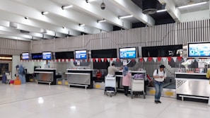 a group of people waiting in line at an airport