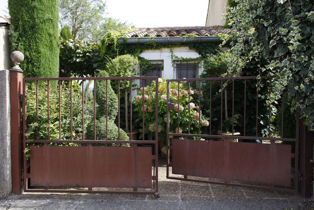 a gate that has a bunch of flowers on it